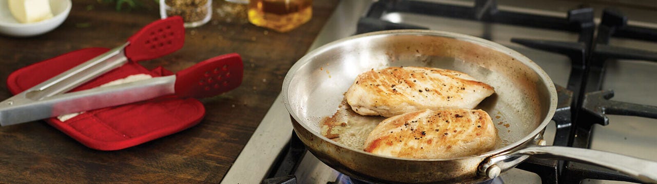 Cooking chicken breast in a skillet on the stove